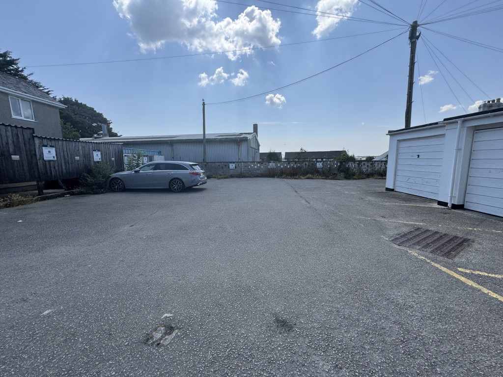 Lot: 65 - TWO STOREY COMMERCIAL UNIT WITH POTENTIAL, DETACHED BLOCK OF FOUR GARAGES AND CAR PARK - Car parking area